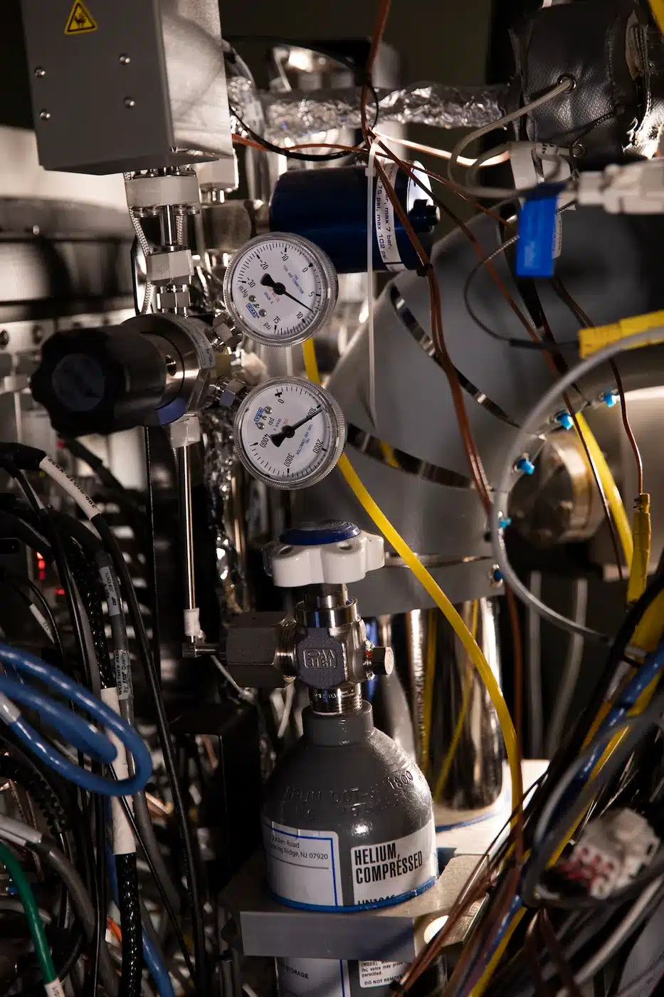 A machine with intricate wiring used for lithography.