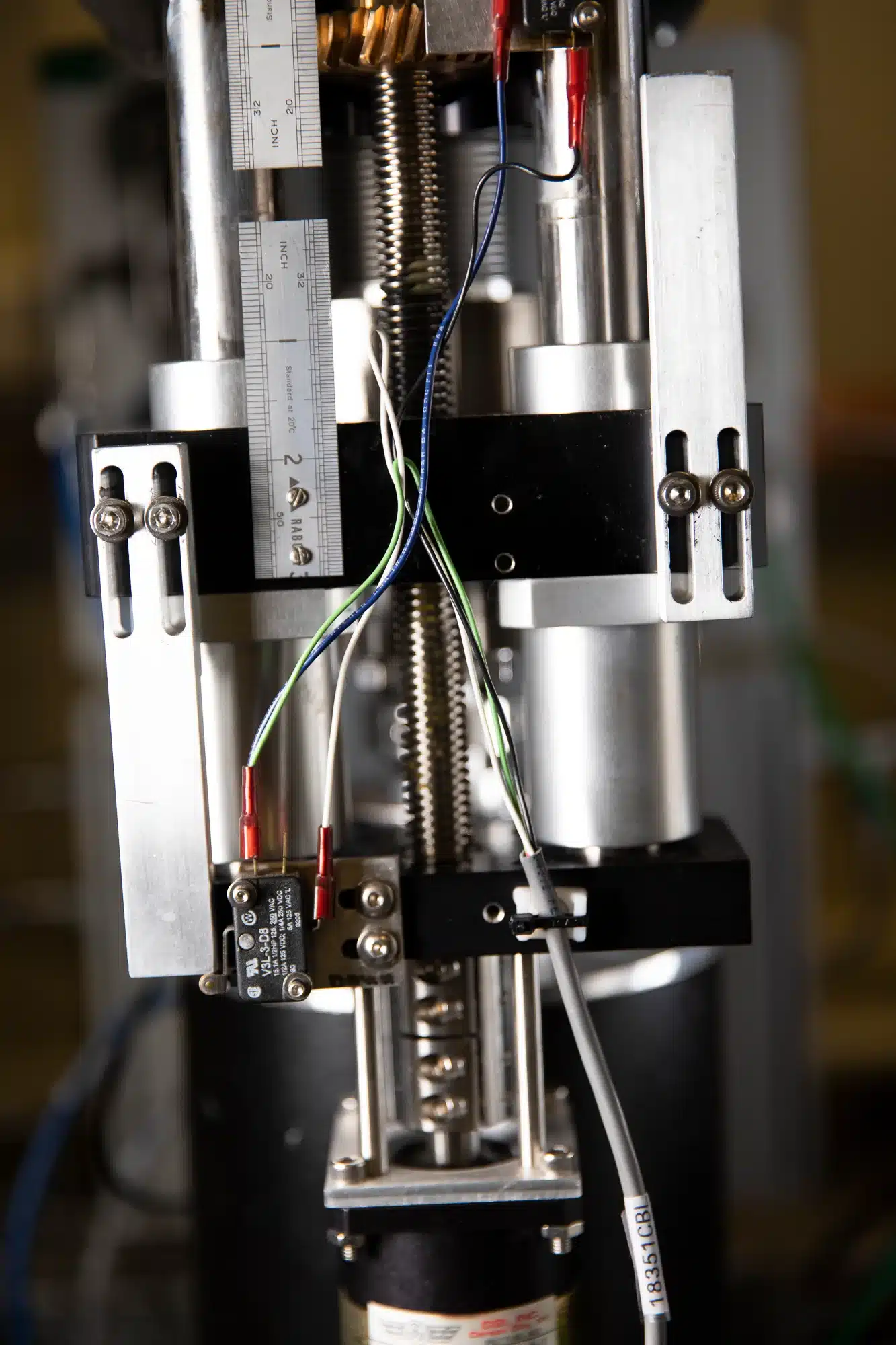 A close up of a machine with wires attached to it, showing elements of microscopy and nano sciences.